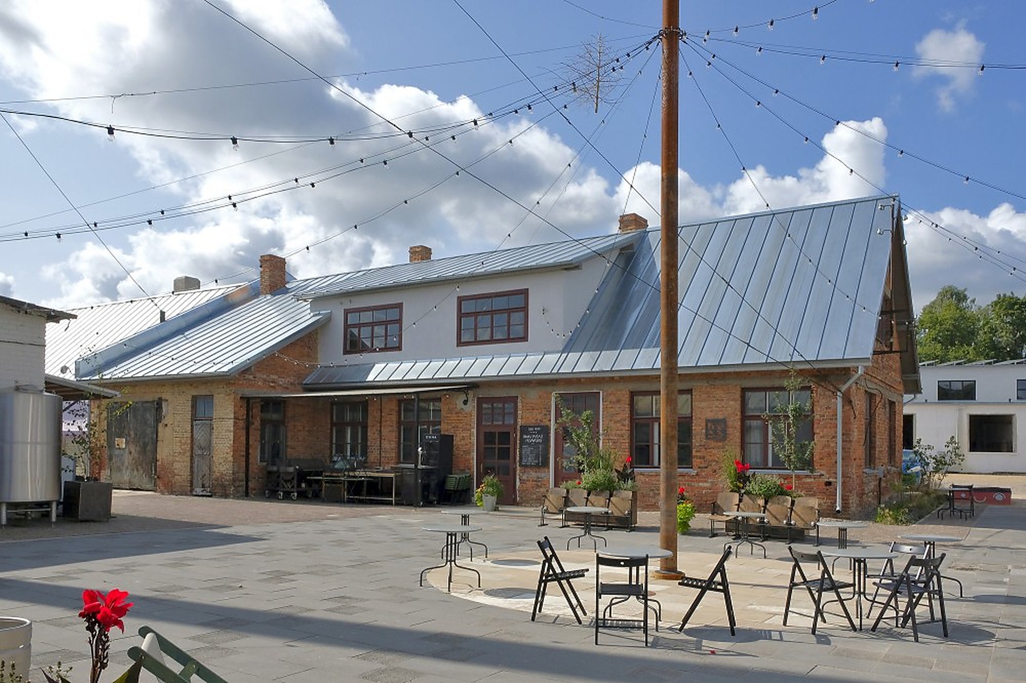 KOPA’s end of the yard, tables out. In summer this is where the quarter eats.