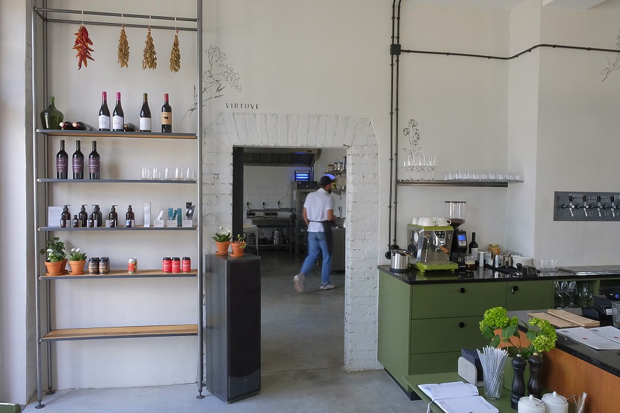 Inside KOPA, with the smoked sausages hanging where you can see them being got on with.