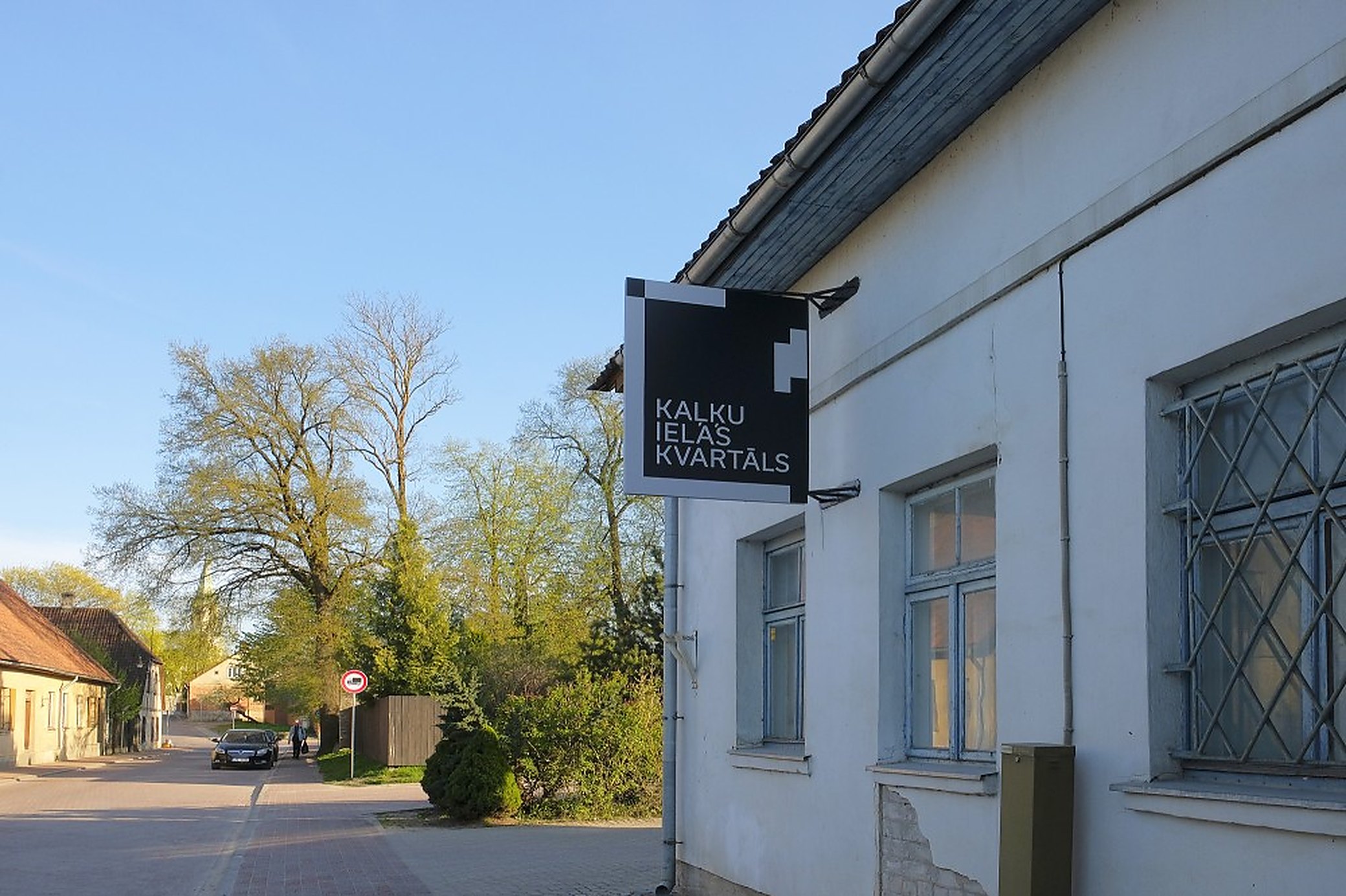 The sign on the corner. From the street it still looks like the garage block it was.