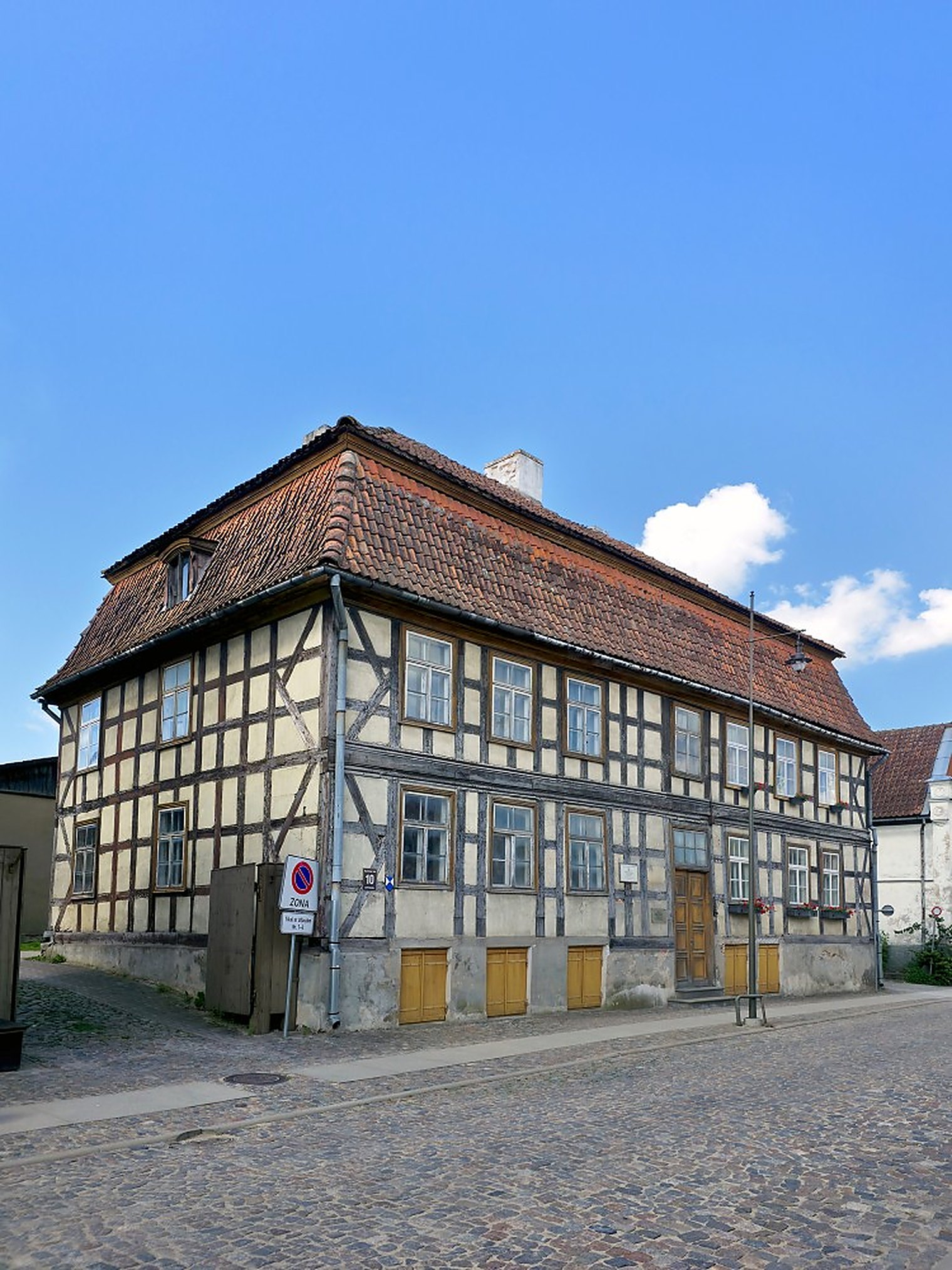 The former court pharmacy of Duke Jacob. Exposed timber framing of exactly the kind the 2023 listing is about.