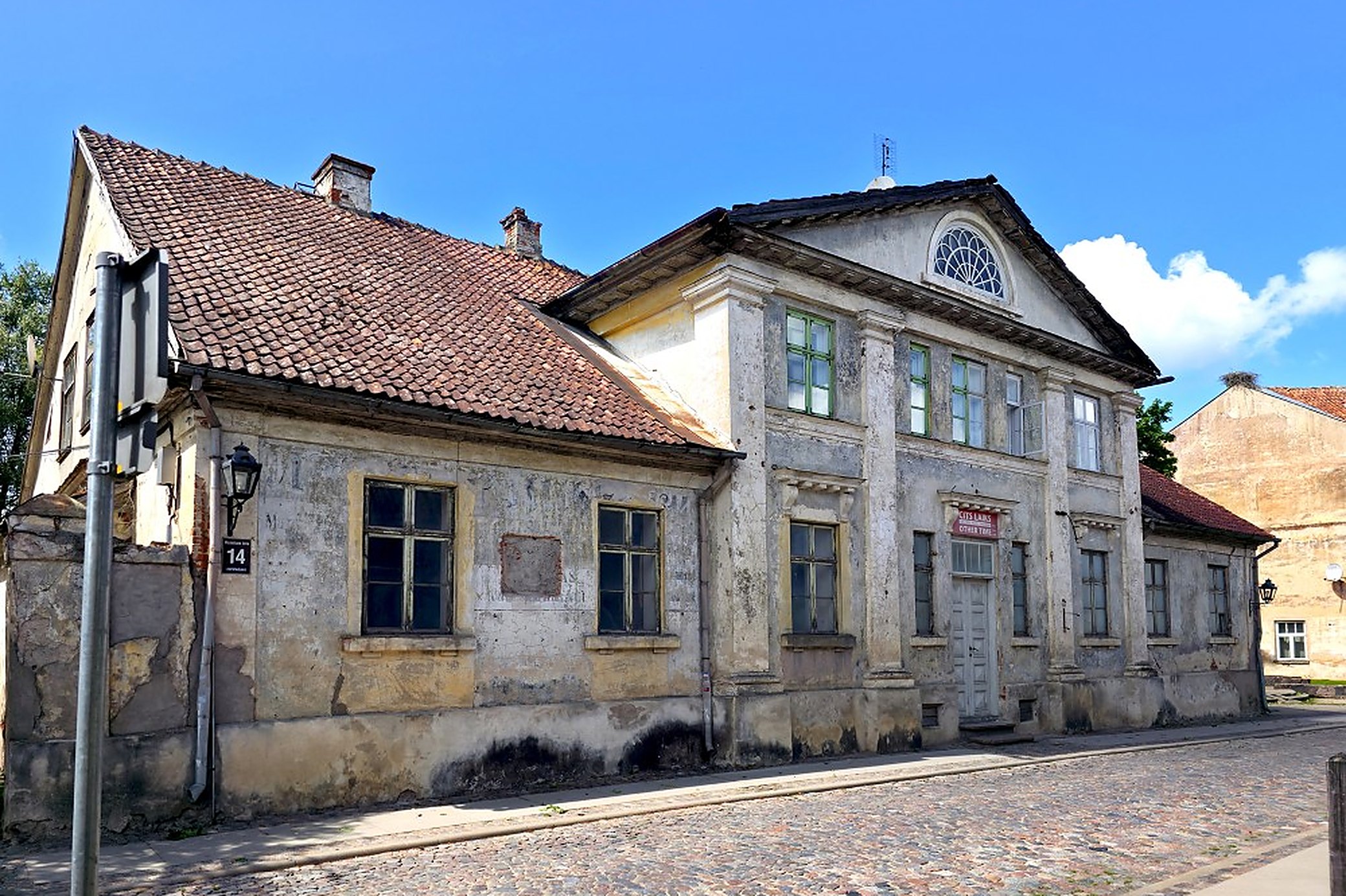 Baznīcas iela 14, plaster coming off it. Nothing here has been tidied up for visitors.